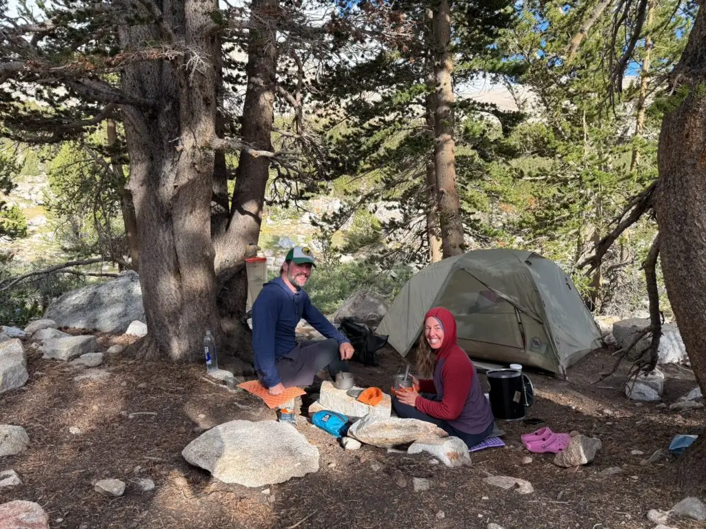 Yosemite WIlderness Company guides and owners Evan and Shawna, at camp making dinner